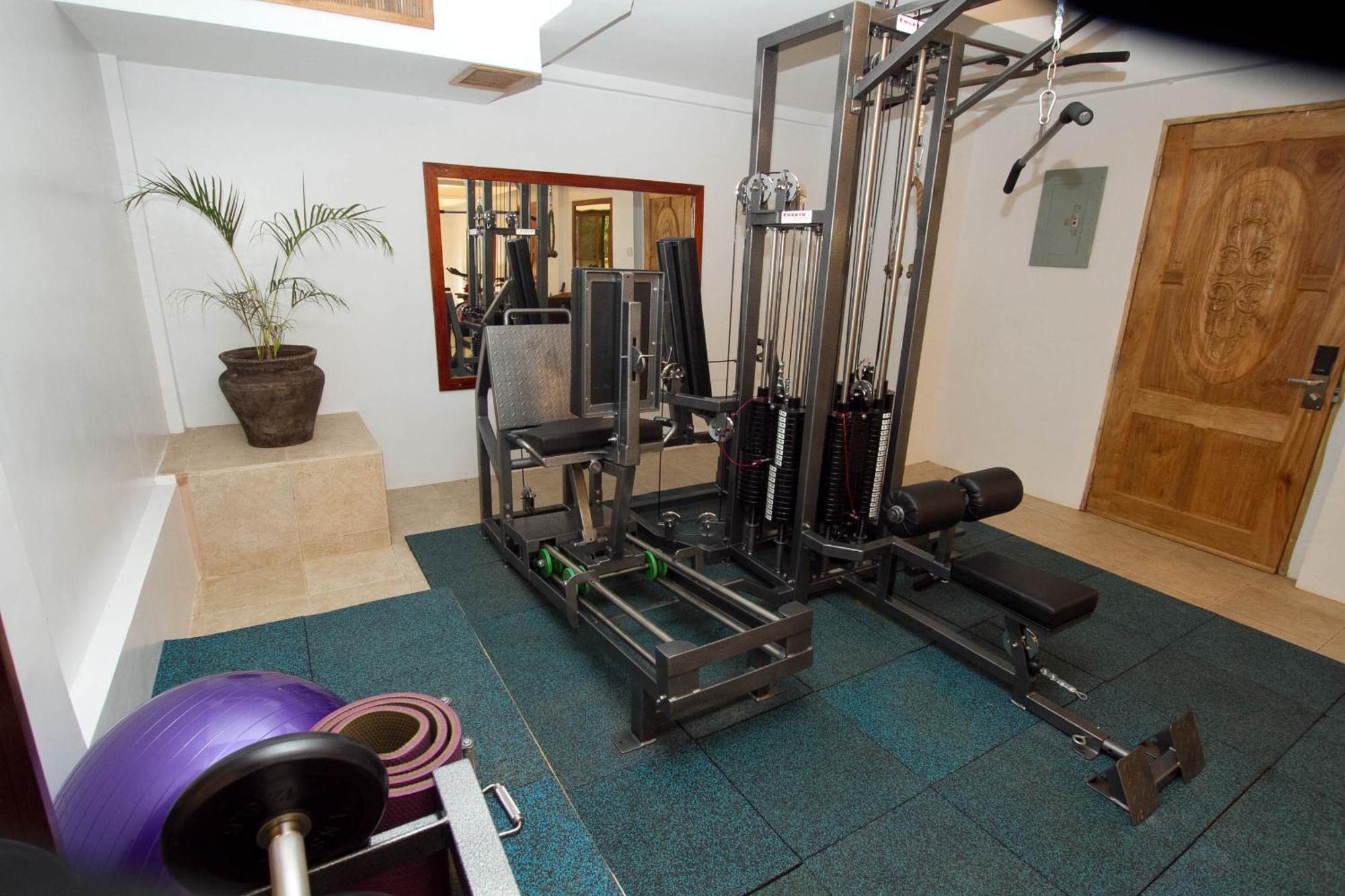 Ambassador In Paradise Balabag  Экстерьер фото A typical home gym